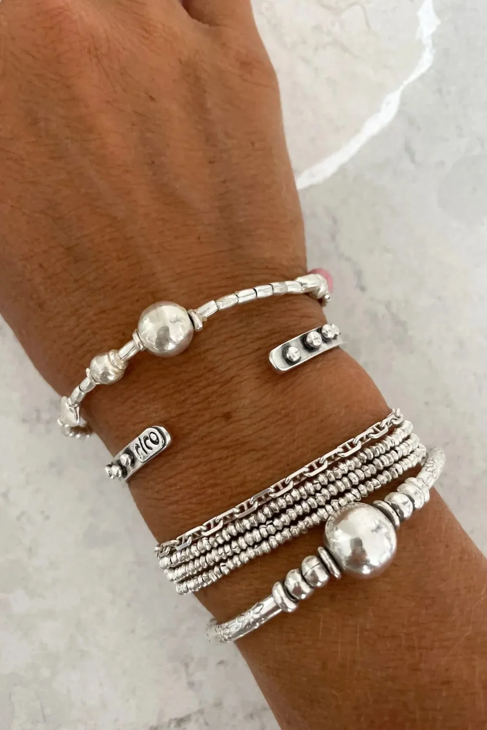 pure silver bracelet with ball bead centre and glass bead pink colour pop. ocean safe silver jewelry