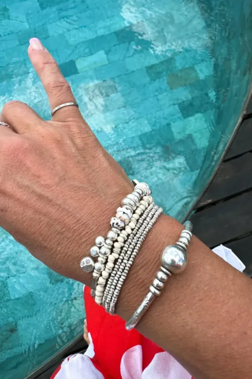 This silver and natural tiger shell bracelet by Rico Designs is handmade in Australia and safe to wear in the ocean. A perfect everyday piece for active women. scattered shells bracelet
