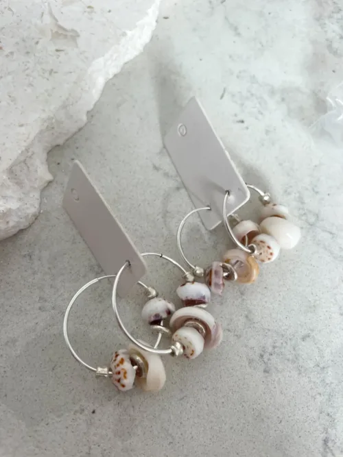 Handmade sterling silver hoop earrings with puri shells– Add style to any outfit