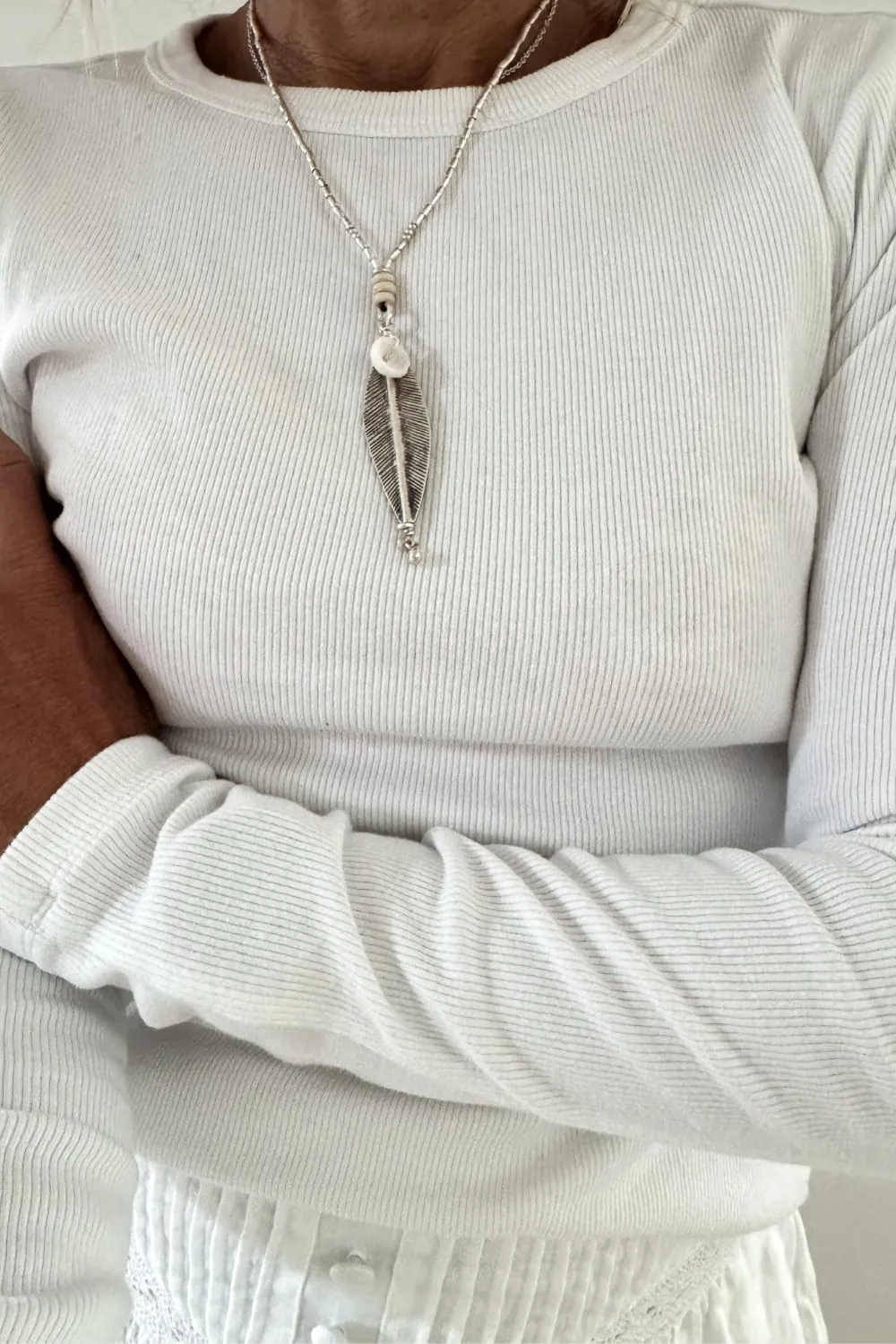 island girl beach inspired silver necklace with natural puri shell and leaf pendant