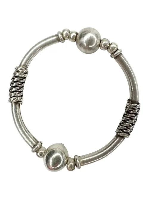 solid pure silver curve bar stretch bracelet. Easy to slip oxn and off. Ocean safe and strong. looks great in a bracelet stack