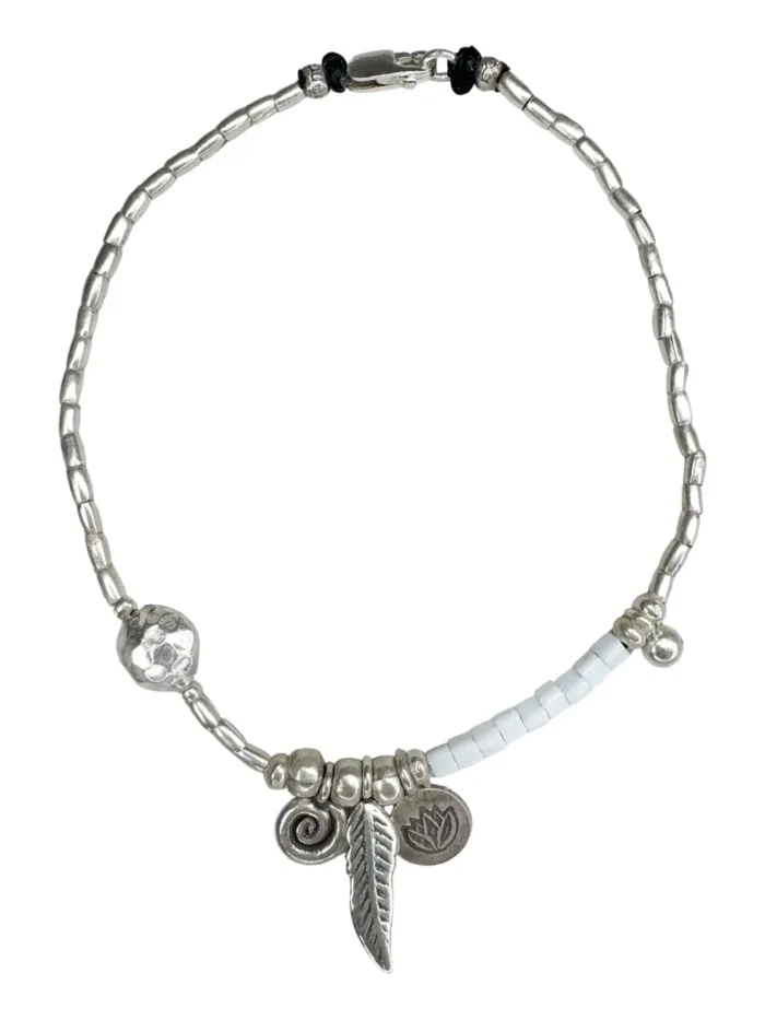 pure silver anklet with seed beads and spiral pure silver charm. Ocean safe. Silver jewellery for beach lovers.