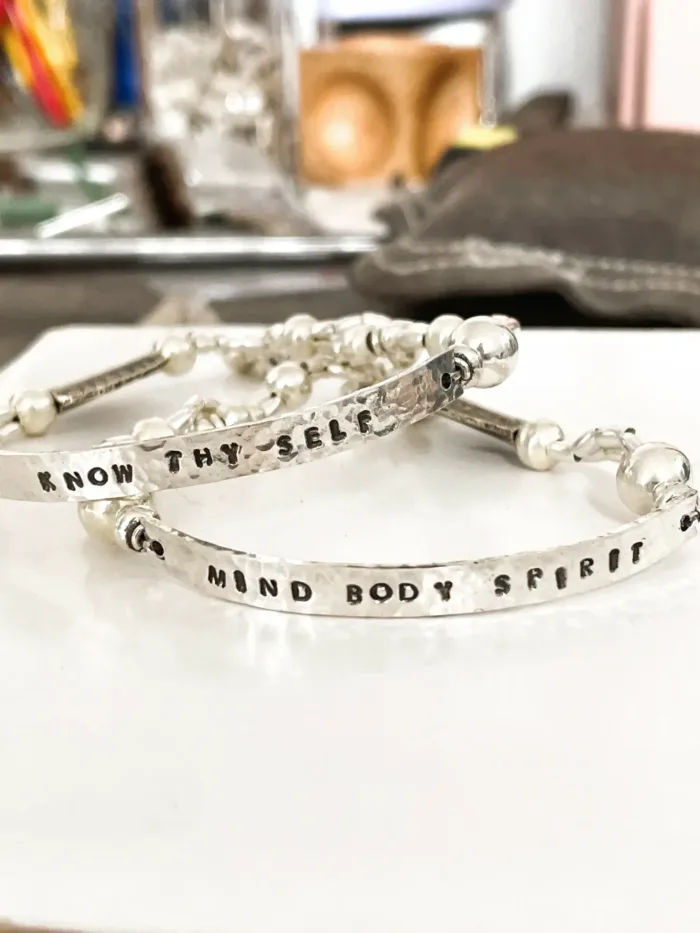 customisable hand stamped bracelet. sterling silver stretch bracelet for the active adventurer. water safe