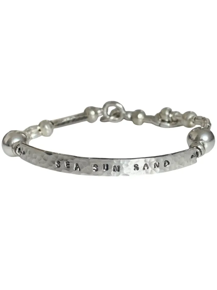 customisable hand stamped bracelet. sterling silver stretch bracelet for the active adventurer. water safe