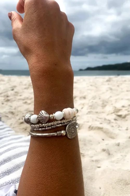 island girl vibes with this natural paui shell and pure silver bracelet. Perfect resort style jewellery and to wear in a bracelet stack. water safe and elastic stretch so its easy to slip on