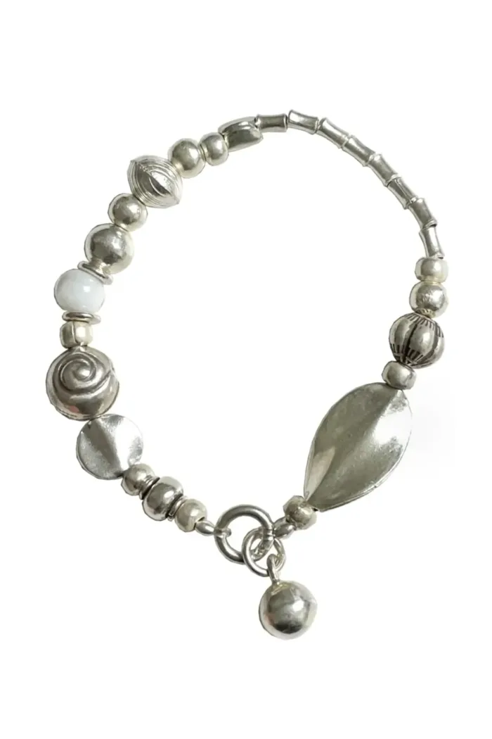 pure silver strong stretch elastic bracelet with white lamp work beads. Easy to slip on and off. Water safe