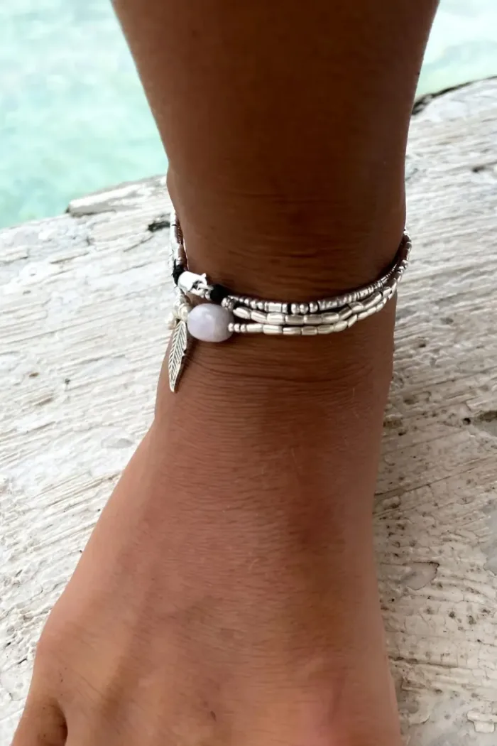 ocean inspired silver jewellery. Pure silver wrap bracelet with silver feather charm and kunzite gemstone - for a beach vibes look- water safe for everyday wear. 3 styles in 1