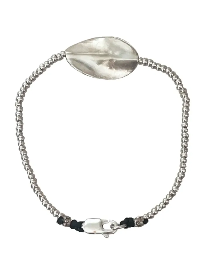 pure silver bracelet with warped disc. tug proof - perfect for active mums. ocean safe