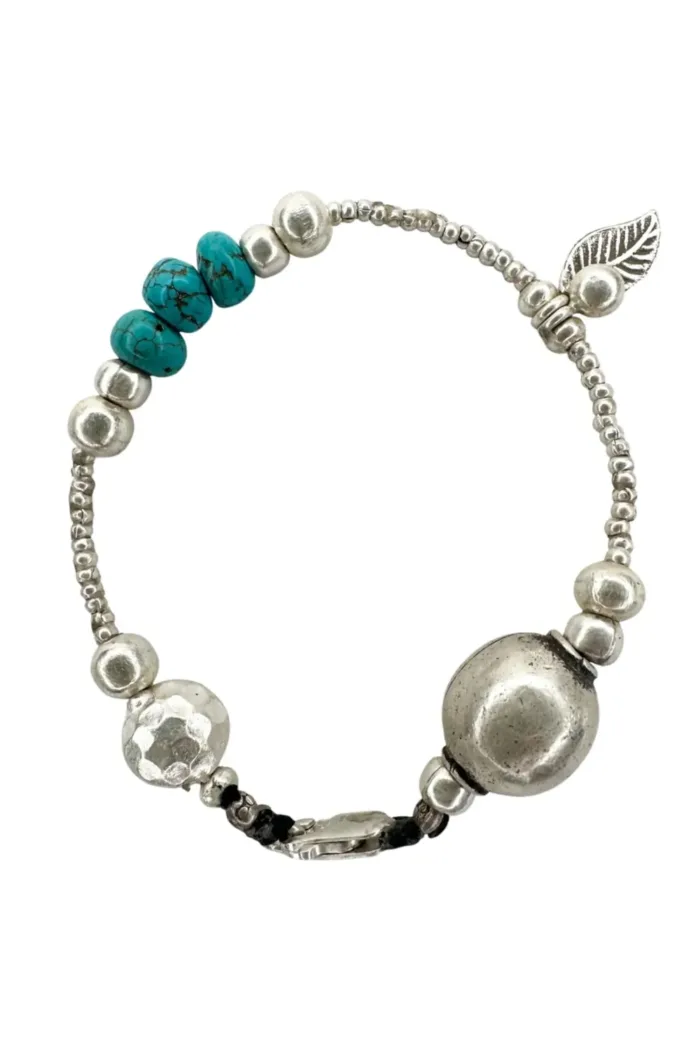 pure silver bracelet with turquoise gemstones. the perfect addition to add texture to your bracelet stack. ocean safe silver jewelry
