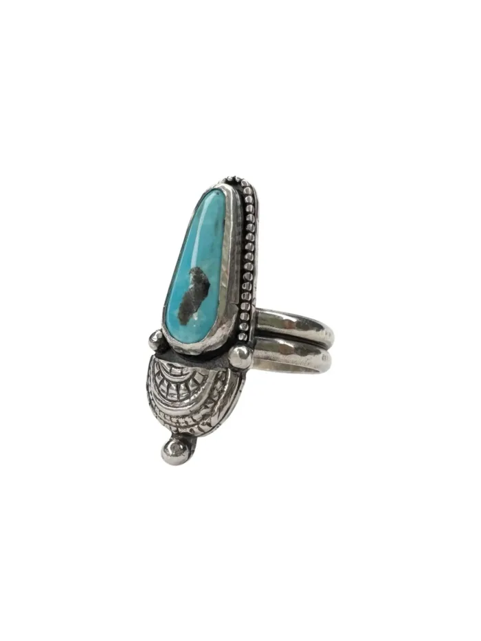 handmade sterling silver natural turquoise ring by rico designs silver jewellery. tear shape turquoise gemstone set in sterling silver with small creaser. Handmade in Sydney Australia
