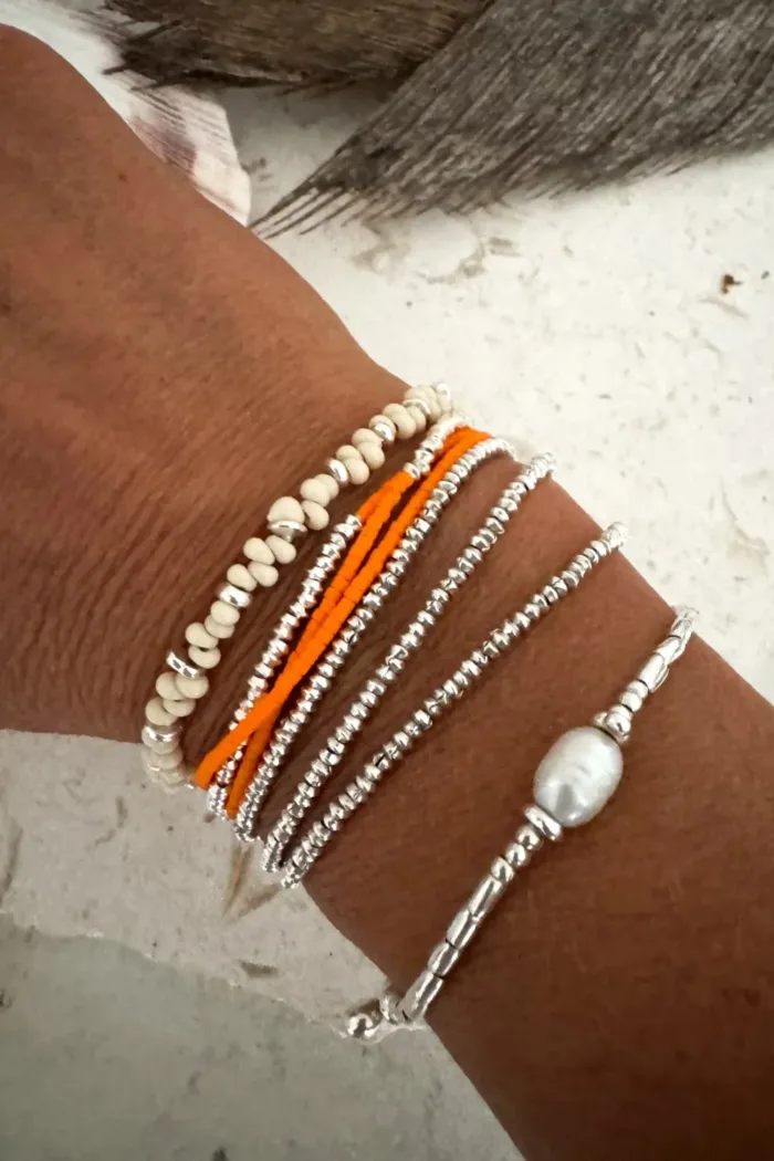 Handmade pure silver wrap bracelet featuring a bright summer colour seed bead of your choice – a great minimal wrap bracelet style for everyday wear