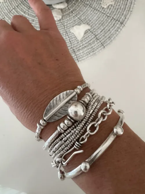 2 looks 1 bracelet. large silver leaf curve bar pure silver bracelet. Strong stretch to easily slip on. Ocean safe and looks great styled in a bracelet stack