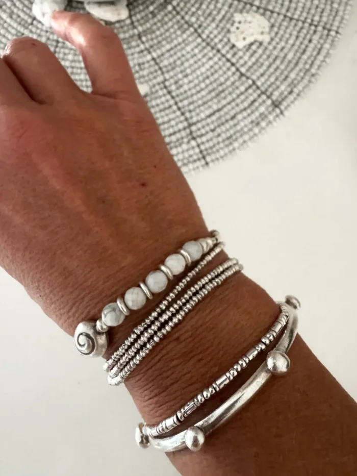 beach inspired pure silver bracelet with spiral silver shell and faceted white agate gemstones. Looks great worn solo or in a bracelet stack. Ocean safe