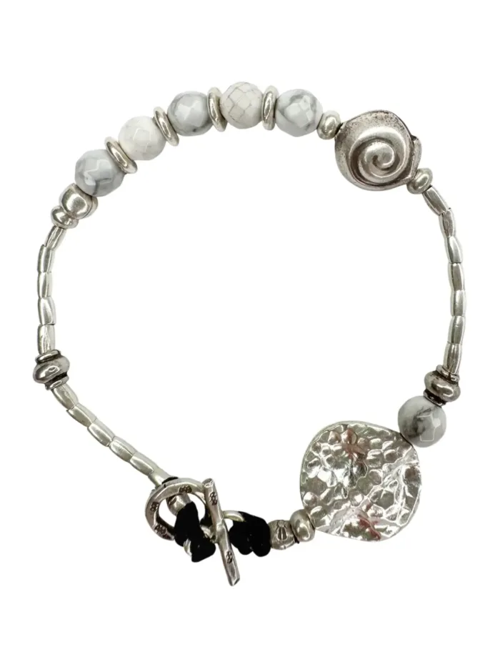 beach inspired pure silver bracelet with spiral silver shell and faceted white agate gemstones. Looks great worn solo or in a bracelet stack. Ocean safe