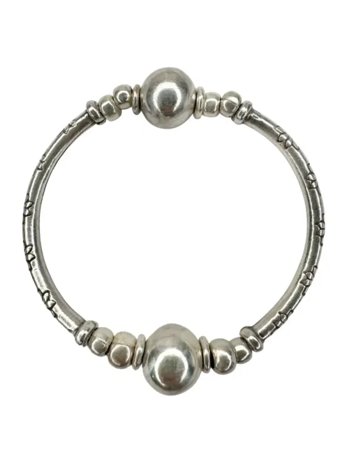pure silver curve bar stretch bracelet with 2 silver balls. perfect for everyday wear and bracelet stacking. ocean safe