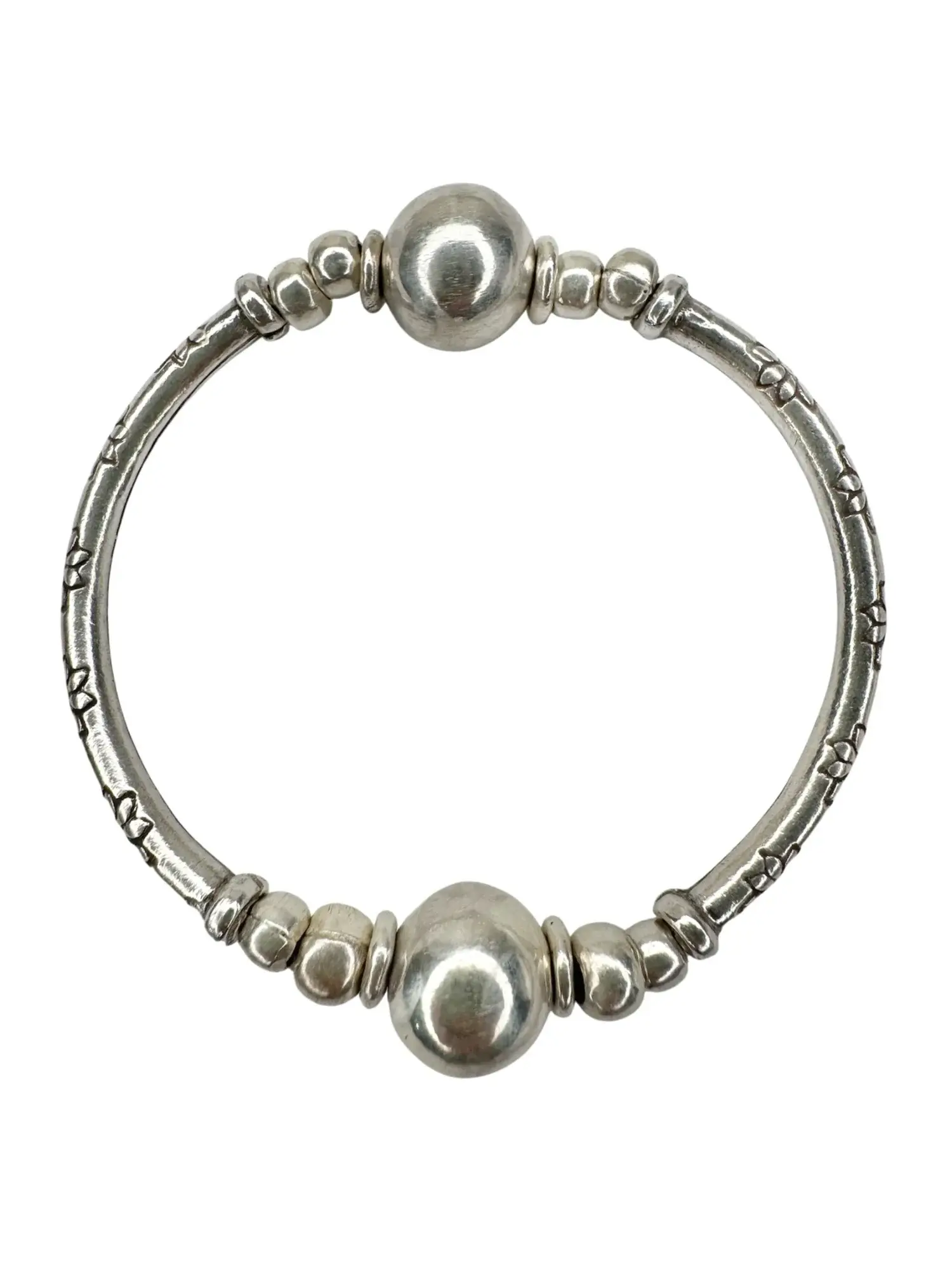 pure silver curve bar stretch bracelet with 2 silver balls. perfect for everyday wear and bracelet stacking. ocean safe