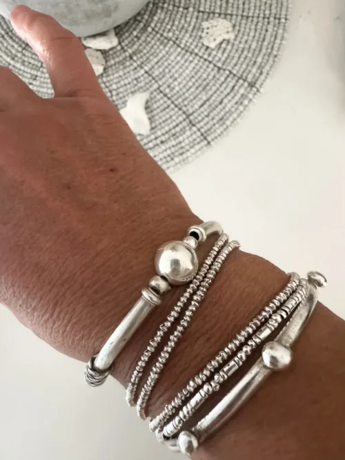 solid pure silver curve bar stretch bracelet. Easy to slip oxn and off. Ocean safe and strong. looks great in a bracelet stack