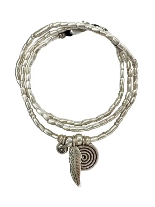 bohemian style silver jewellery. Pure silver wrap bracelet with silver spiral char, feather charm and eye protection charm - for a boho beach chic look- water safe for everyday wear. 3 styles in 1