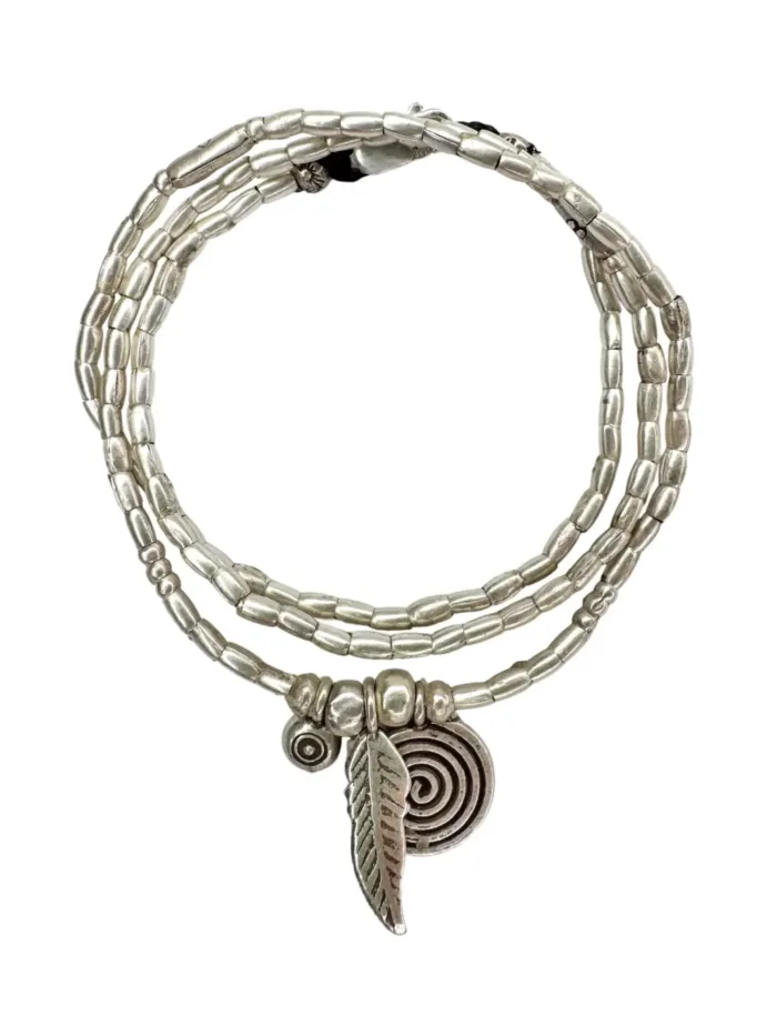bohemian style silver jewellery. Pure silver wrap bracelet with silver spiral char, feather charm and eye protection charm - for a boho beach chic look- water safe for everyday wear. 3 styles in 1