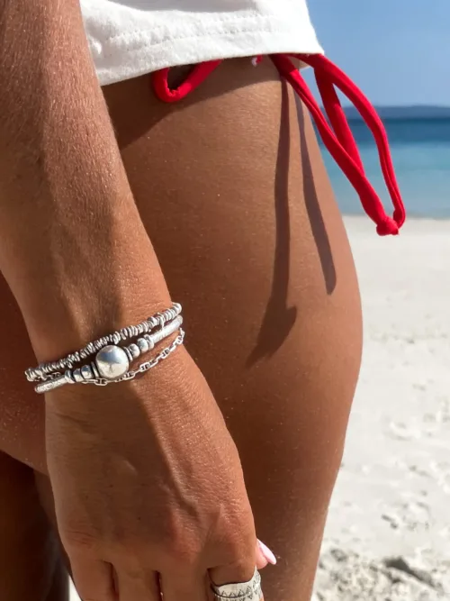 beach inspired pure silver curve bar stretch bracelet with 2 silver balls. perfect for everyday wear and bracelet stacking. ocean safe