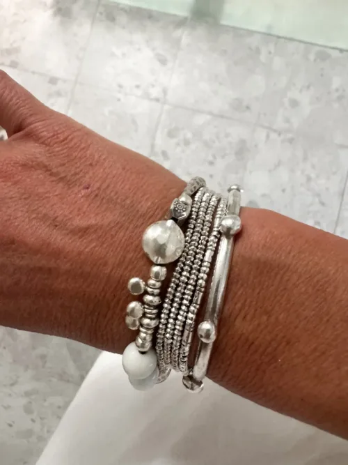 unique handmade pure silver bracelet with white glass beads. Looks great in a bracelet stack. Ocean safe and tug proof for mum life