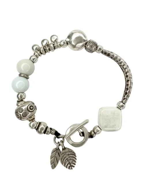 unique handmade pure silver bracelet with white glass beads. Looks great in a bracelet stack. Ocean safe and tug proof for mum life