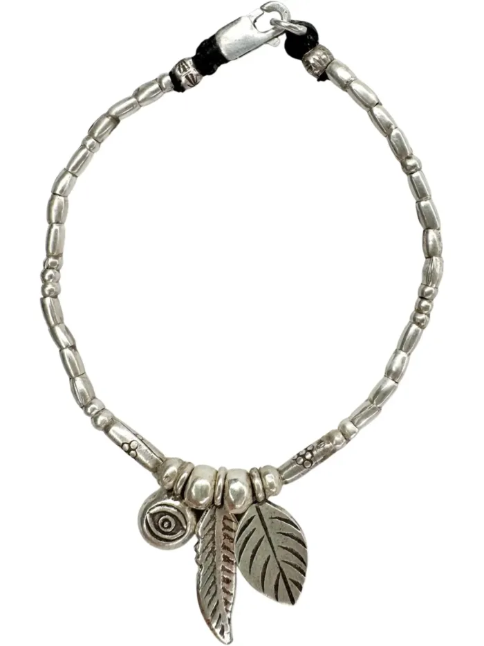 pure silver women's bracelet with feather pendant and eye charm. Perfect to wear everyday. Ocean safe and tub proof for active mums.