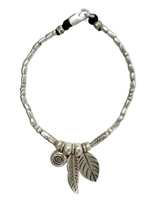 pure silver women's bracelet with feather pendant and eye charm. Perfect to wear everyday. Ocean safe and tub proof for active mums.
