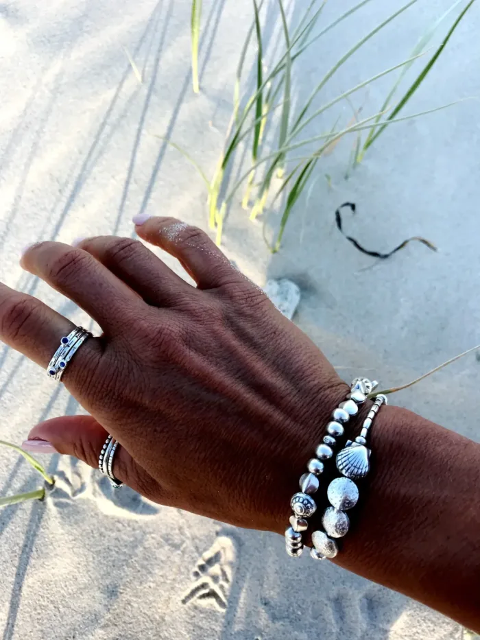handmade pure silver bracelet. perfect for a bracelet stack. Stitch elastic so easy to slip on. ocean safe