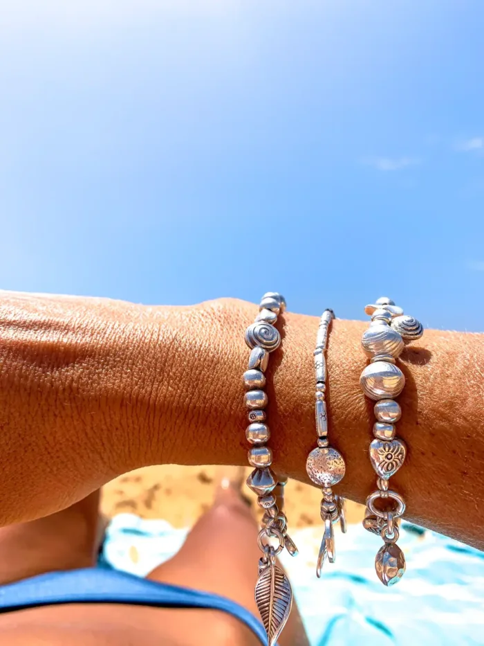 handmade pure silver bracelet. perfect for a bracelet stack. Stitch elastic so easy to slip on. ocean safe