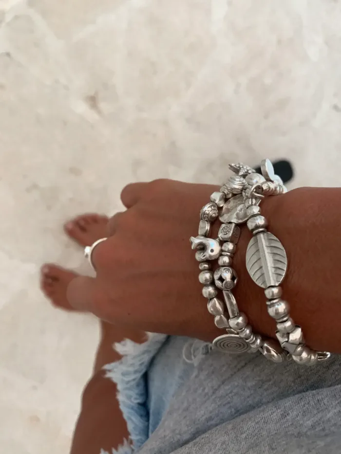 handmade pure silver bracelet. perfect for a bracelet stack. Stitch elastic so easy to slip on. ocean safe