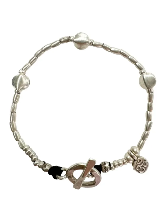 pure silver bracelet with small silver discs. tug proof - perfect for active mums. ocean safe