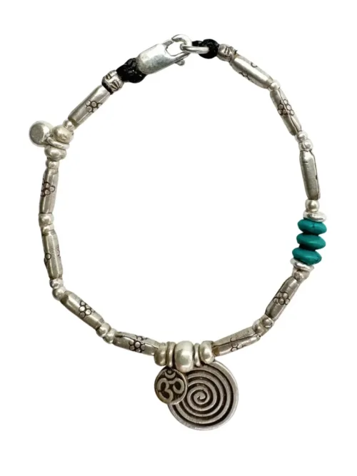 pure silver women's bracelet with spiral pendant and om charm. Perfect to wear everyday. Ocean safe and tub proof for active mums.