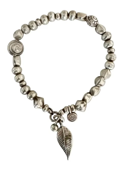 handmade pure silver bracelet. perfect for a bracelet stack. Stitch elastic so easy to slip on. ocean safe