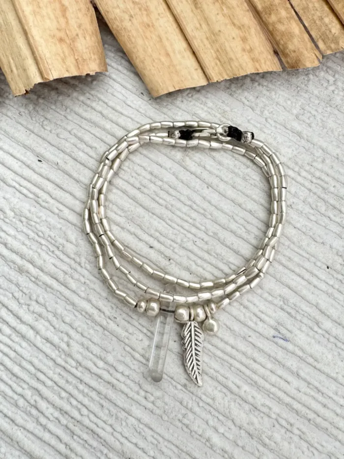 bohemian style silver jewellery. sterling silver wrap bracelet with crystal quartz and feather charm - water safe for everyday wear. 3 styles in 1