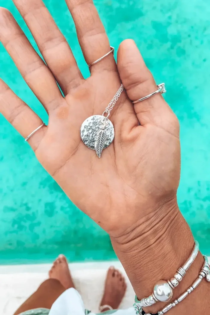 sterling silver disc pendant necklace on sterling silver chain with silver feather pendant handmade ocean safe-jewellery. Sunrise Silver Necklace