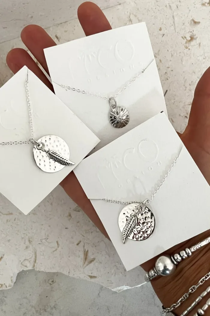 sterling silver disc pendant necklace on sterling silver chain with silver feather pendant handmade ocean safe-jewellery. Sunrise Silver Necklace