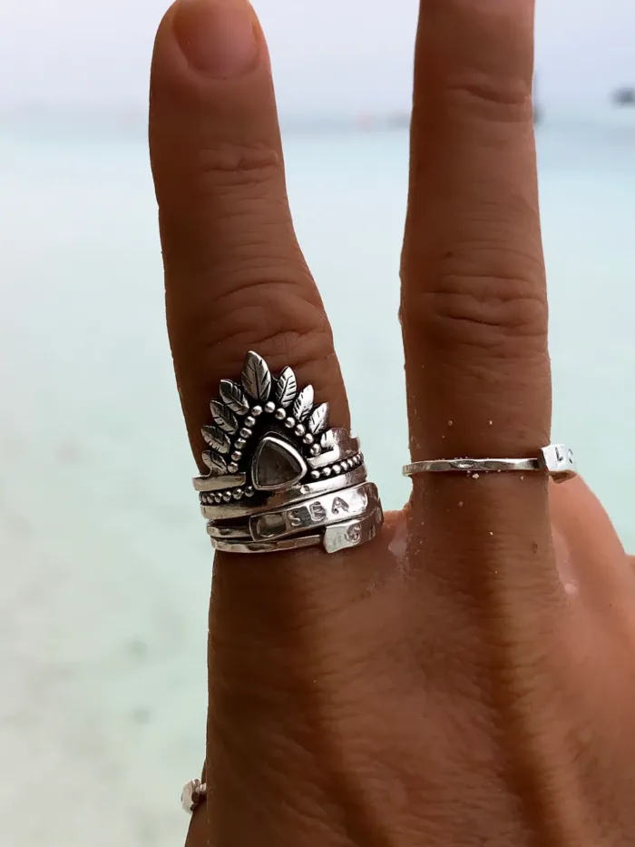 double stack sterling silver ring with crystal quartz and feather design. boho style. ocean safe
