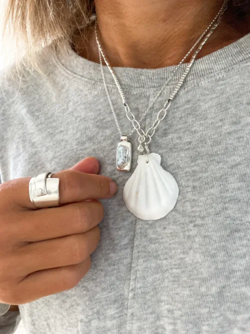 ocean inspired silver necklace with large clam shell pendant. Handmade in australia ocean safe. Perfect for layering in a necklace stack