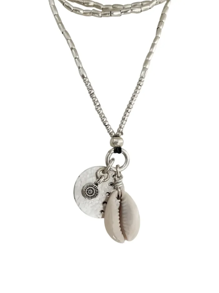 pure silver necklace with hand cut sterling silver round disc pendant and beach inspired cowrie shell pendant. Medium length necklace. beach vibes style. Ocean safe for everyday wear