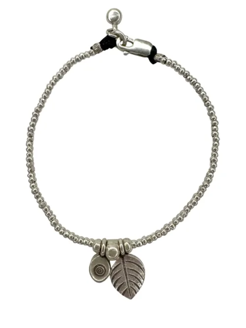 pure silver bracelet with leaf and evil eye pendant. tug proof - perfect for active mums. ocean safe