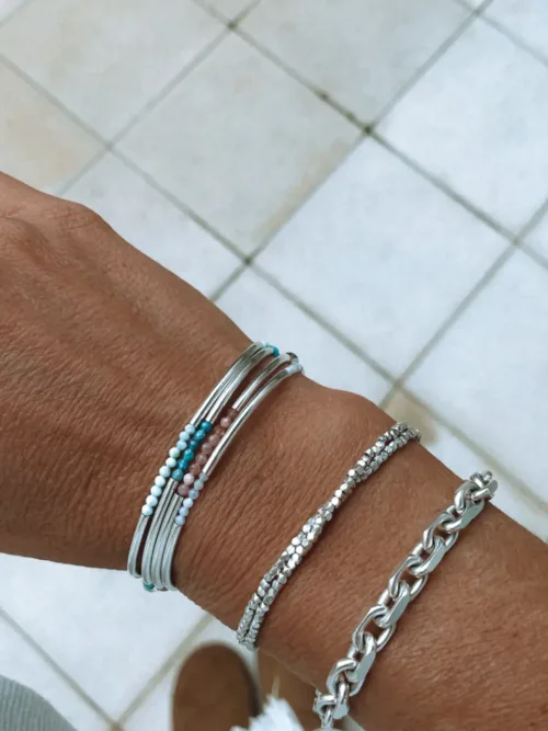 sterling silver curve bar bracelet with small faceted gemstones. wear solo or stacked up.
