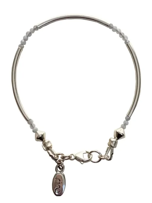sterling silver curve bar bracelet with small faceted gemstones. wear solo or stacked up.