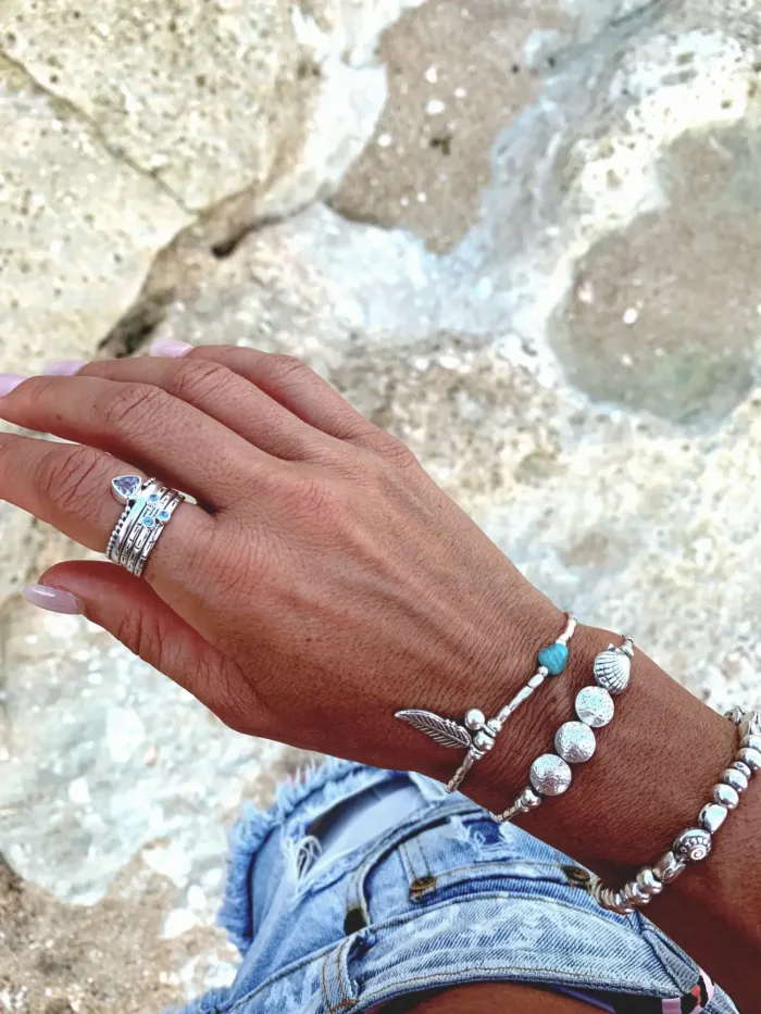 beach inspired pure silver bracelet with clam shell and large leaf. ocean safe. tug proof - perfect for active mums.