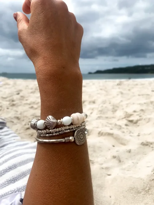island girl vibes with this natural paui shell and pure silver bracelet. Perfect resort style jewellery and to wear in a bracelet stack. water safe and elastic stretch so its easy to slip on