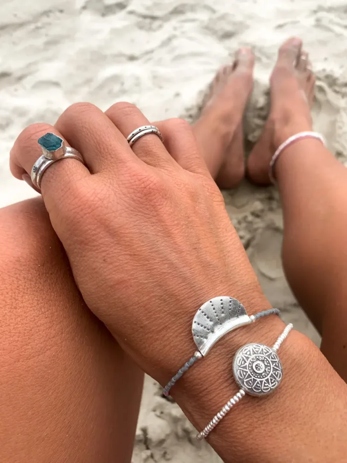 silver crescent disc with grey and pink seed bead. style this bracelet for a minimal look or a pop of colour to your bracelet stack