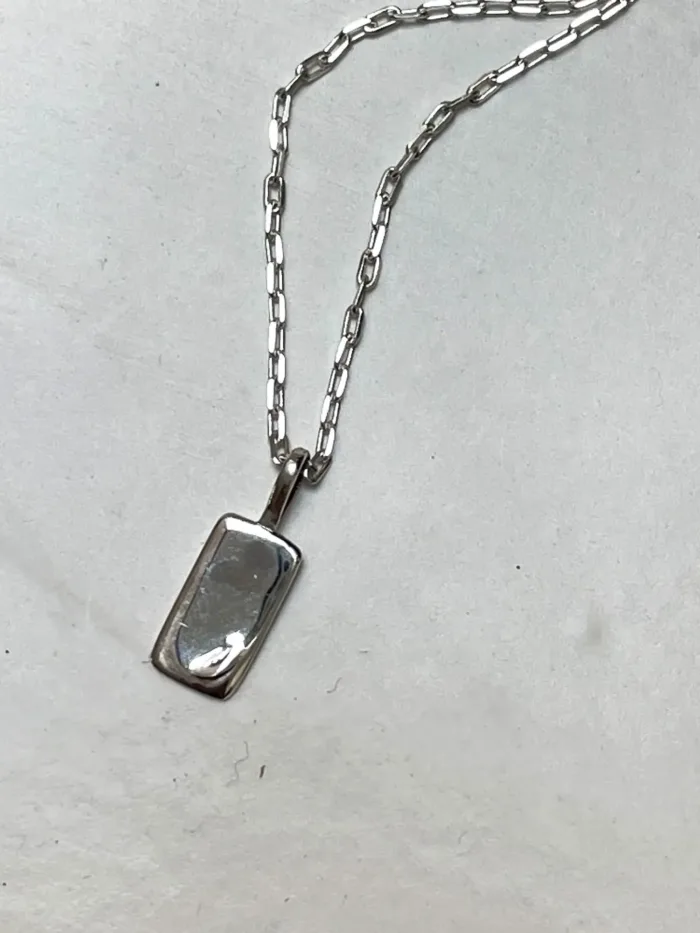 petite sterling silver rectangle pendant with moon detail on sterling silver chain. Dainty necklace. ocean safe