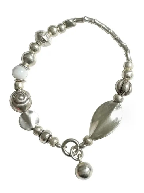 pure silver strong stretch elastic bracelet with white lamp work beads. Easy to slip on and off. Water safe
