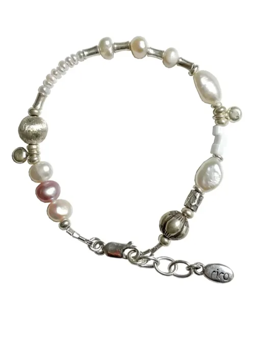 freshwater pearl silver bracelet with lots of charms.