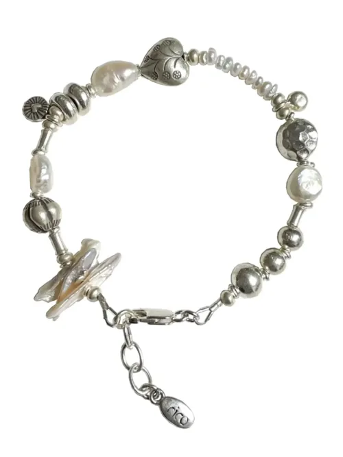 freshwater pearl silver bracelet with lots of charms.